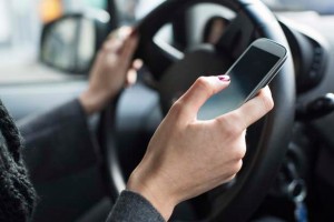 Woman Using Mobile Phone While Driving